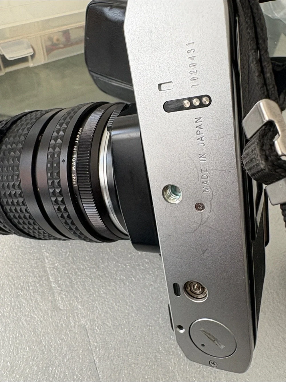 Olympus Silver and Black 35mm SLR Camera with Black Zoom Lens parts not tested